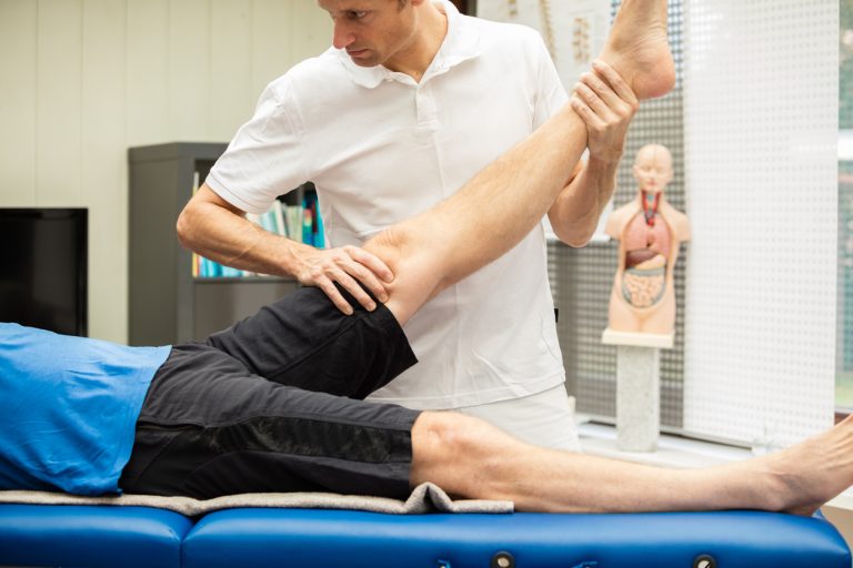 Doctor performing Lasegue test A doctor, performing Lasegue test at a male patient. This test stretches the nerves of the leg and spine and gives information about the origin of pain.