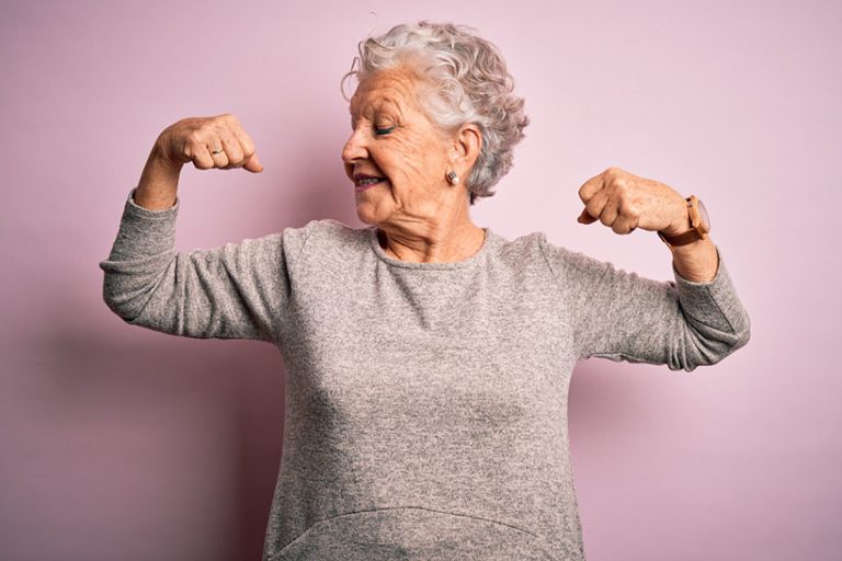 Senior beautiful woman wearing casual t-shirt standing over isolated pink background showing arms muscles smiling proud. Fitness concept. Senior beautiful woman wearing casual t-shirt standing over isolated pink background showing arms muscles smiling proud. Fitness concept.