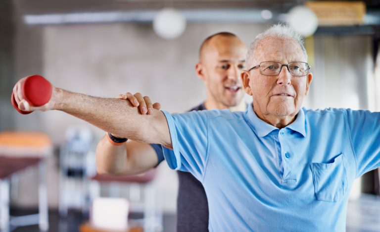This is all you now! Shot of a physiotherapist helping a senior man with weights