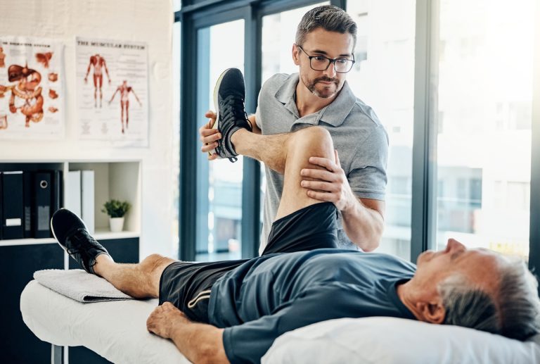 Just relax Shot of a friendly physiotherapist treating his mature patient in a rehabilitation center