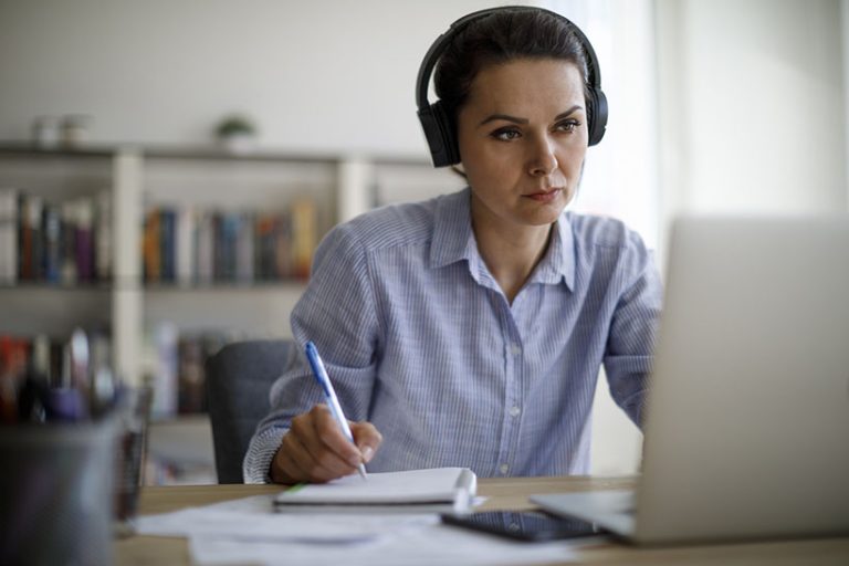 Mature woman working from home during COVID-19 pandemic Mature woman working from home during COVID-19 pandemic