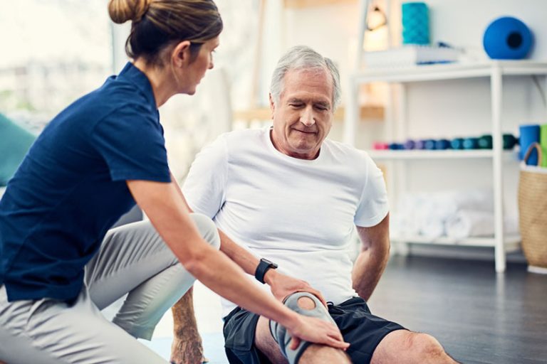 Let me know if this helps Cropped shot of an attractive young female physiotherapist working with a senior male patient