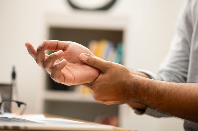 Male Male hand get hurt and pain in hand. Symptom office syndrome. He has symptom stress in his hand stiffness causing inconvenience.