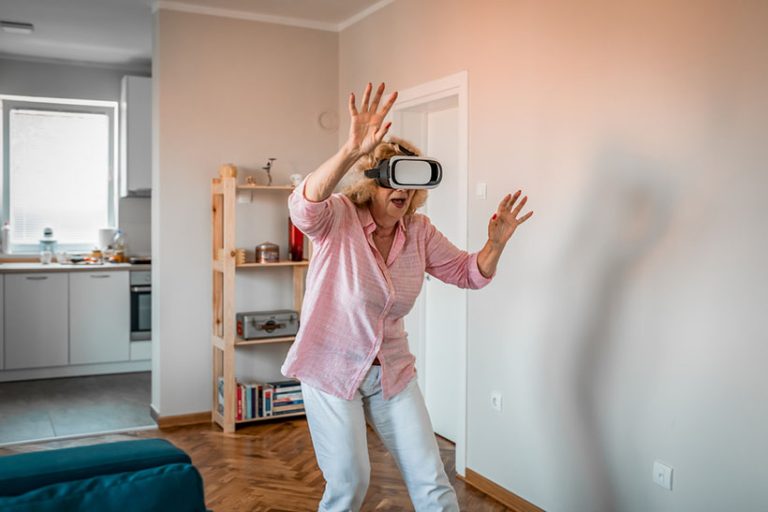 Senior woman having fun with virtual reality headset Happy senior woman having fun with vr headset.technology